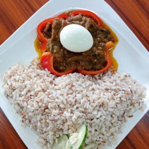 Ofada rice and sauce with egg